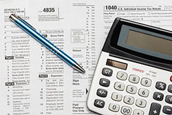 image of tax forms and calculator